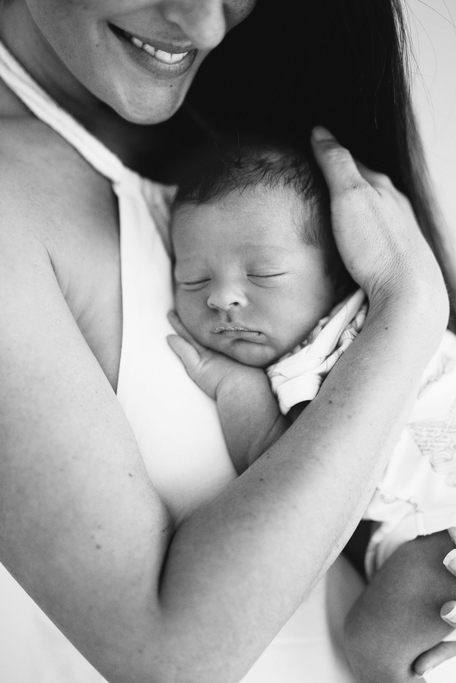 Mother with sleeping newborn