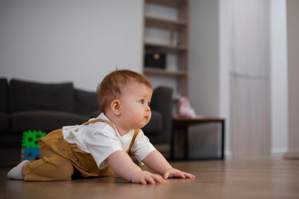 Baby in crawling position during a developmental leap, a stage that can impact sleep patterns if foundations aren’t in place.