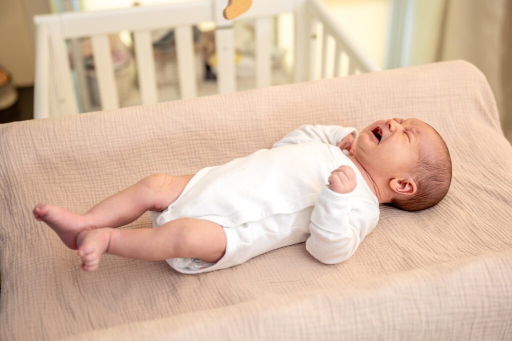 Infant awake in cot during night waking