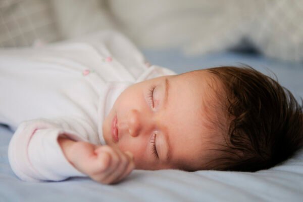 Peacefully sleeping baby in a calm, sleep-friendly environment