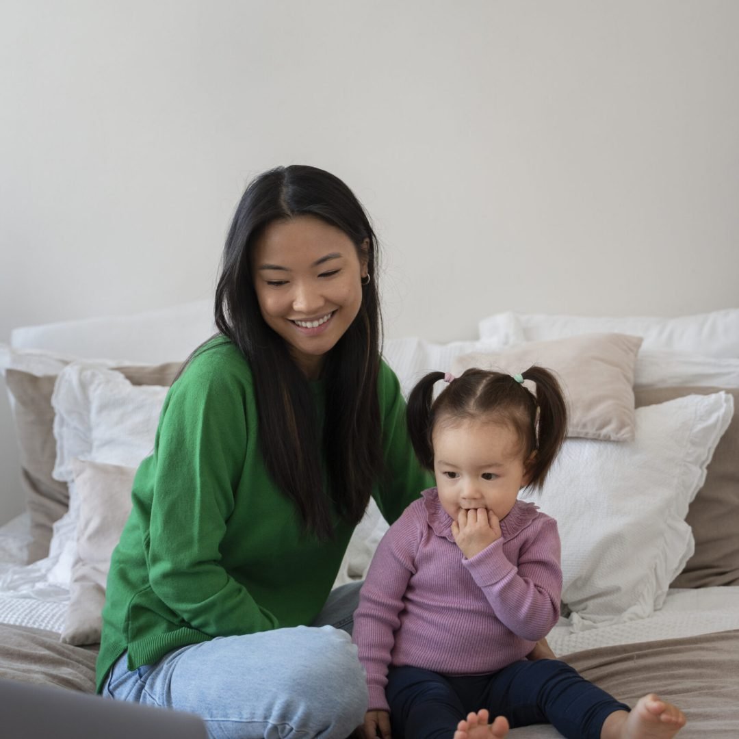 little-asian-girl-spending-time-home-with-her-mother
